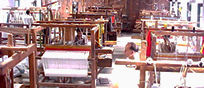 People working on handlooms