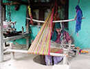 Local lady weaving on pitloom